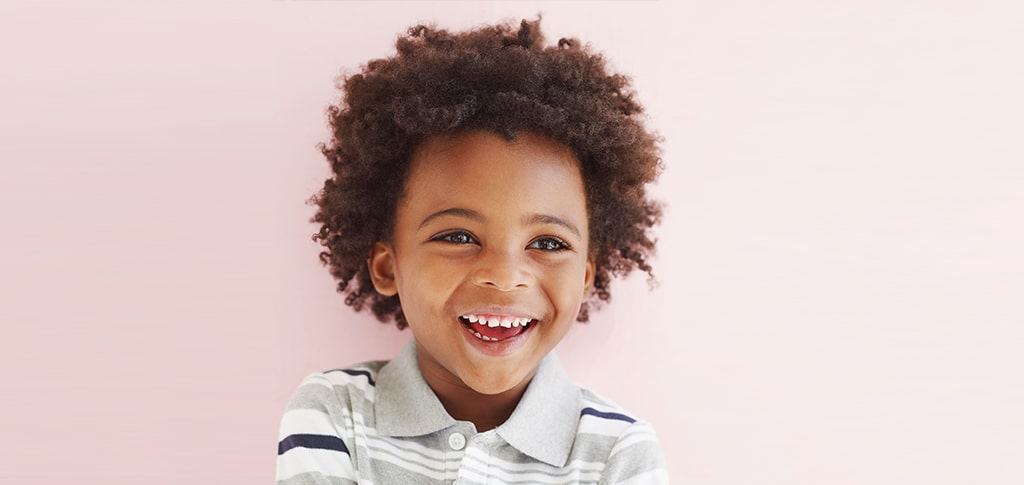 Image of Young Naturally Curly Hair Boy Smiling
