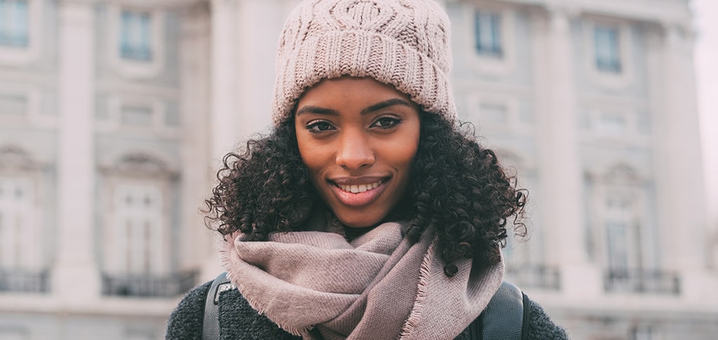 Image of Young black woman with natural hair outside in winter