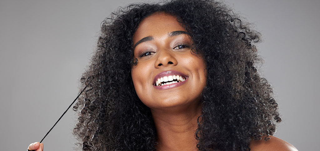Image of black woman with natural curly hair
