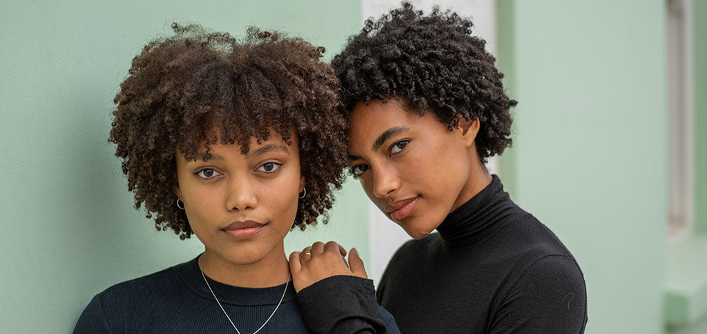 Image of Two Young Black Women With Natural Curly 4c Hair